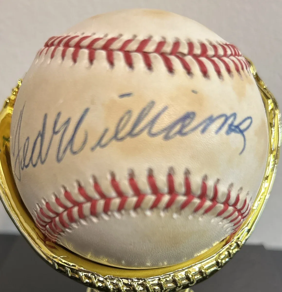 Signature detail on Ted Williams Signed Rawlings American League Baseball.